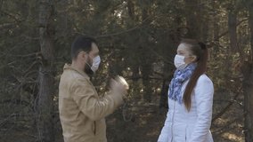funny video about coronavirus - a man and a woman take off medical masks and rejoice in recovery and the end of quarantine