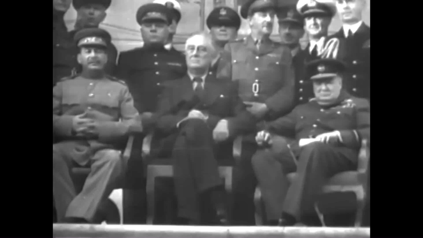 CIRCA 1940s - The big three and general Dwight Eisenhower plan and execute D-Day during World War 2