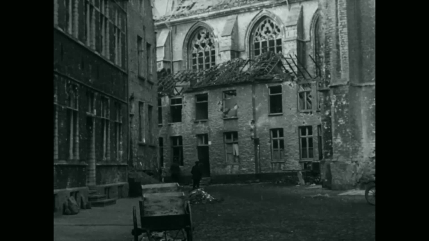 CIRCA 1918 - The rubble in Ypres, Belgium, and soldiers of the 91st Division investigating abandoned tanks, during the Ypres-Lys Operation in WWI.