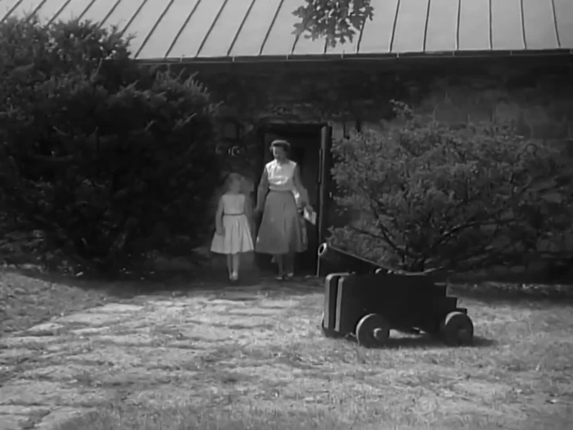CIRCA 1957 - An Army General and his family tour the campus of the Army War College, seeing sights.