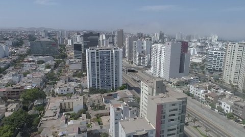 Miraflores district, in Lima Peru. During the lockdown for coronavirus. Empty streets, few public transportation. Aerial view. Some cars and buses in one of the more transit avenues in Lima.