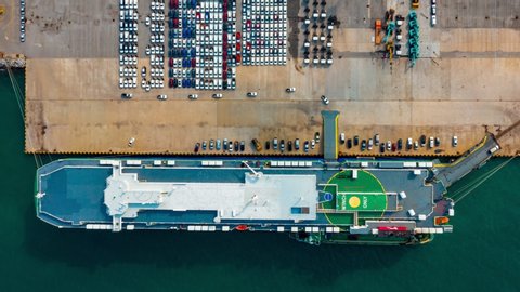 Aerial view ro-ro ship, Cargo ship transportation of business logistic sea freight, New Cars produced by year up in the port for Cargo ship and Cargo import-export around in the world