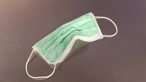 The face mask is removed from the table. Covid-19. Leave space for text - Powered by Shutterstock - Get 15% off with code: PIKWIZARD15