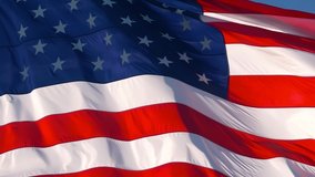 CLOSE UP, SLOW MOTION: American flag waving in wind video footage Realistic USA Flag background. American Flag. Waved highly detailed fabric texture. American flag flying in the wind at sunny day
