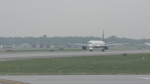 DETROIT - JUNE 9: Delta Airlines Boeing passenger jet departs from Detroit, MI to its home base in Atlanta on June 9, 2015 filmed in 4K