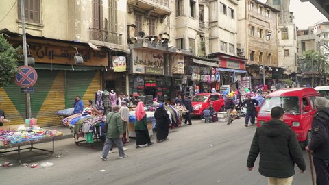 CAIRO, EGYPT - CIRCA 2020: Car traffic and street market in downtown Cairo
