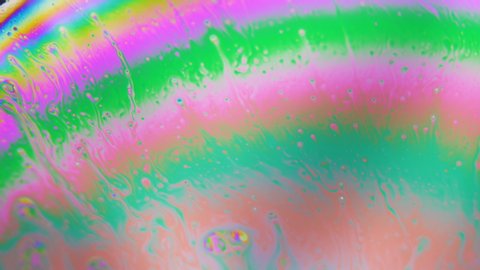 Abstract Multicolored Rainbow liquid . Bunch of bubbles going through layers