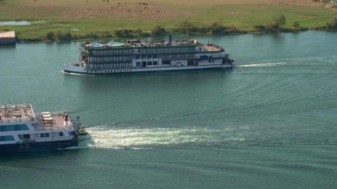 Sohag, Giza  Egypt - March 20 2020: Nile cruise ships passing through Sohag city