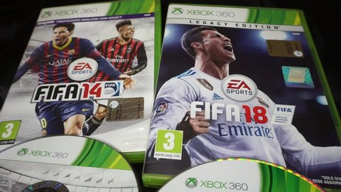 Rome, Italy - March, 20 2020, video game covers for XBOX 360 Fifa 2014 and Fifa 2018, with the image of Lionel Messi, Stephan El Sharaawy and Cristiano Ronaldo.