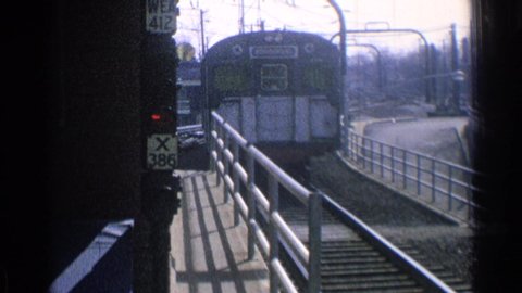 CHICAGO ILLINOIS-1976: Metro Station With Sign And With Blue Metro Train Passing By
