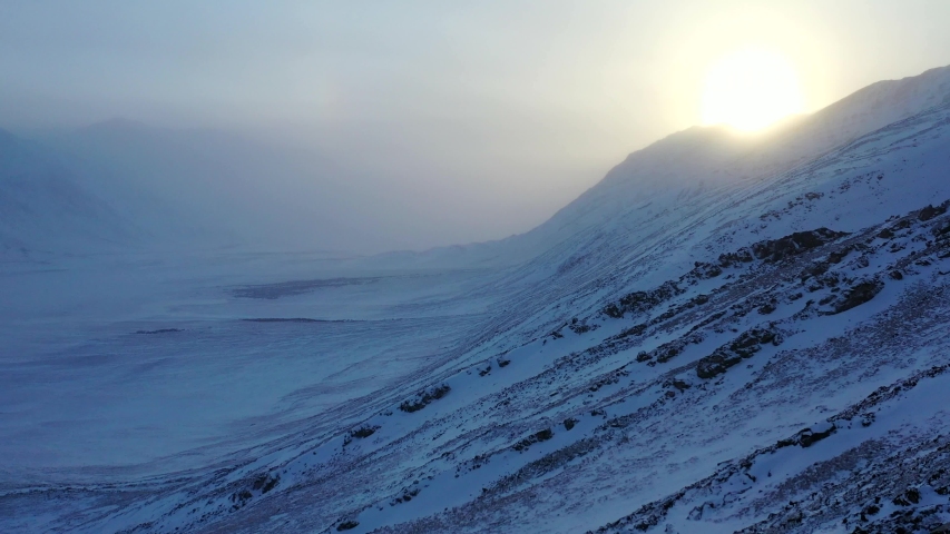 Drone Flight Over the Alaskan Tundra During Winter with the Sunset inside Gates of the Arctic National Park