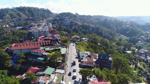 Slow Motion Aerial Shot Of Traffic And Infrastructure In Baguio City Philippines