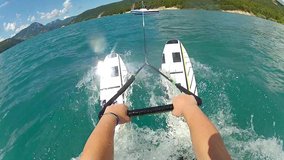 POV view of waterskiing. Water ski action camera, hands hold rope. Summer sports at blue water lake. Wakeboarding behind the motorboat. Concept of active lifestyle. - Powered by Shutterstock - Get 15% off with code: PIKWIZARD15