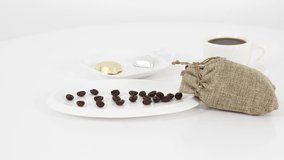 Coffee white cup with sweets on table background. *UHD.