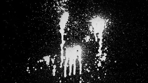 White paint splash on a black background