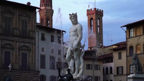 Fountain of Neptune in Piazza della Signoria, main square in Florence, Italy. Historic tourist attraction of Tuscany, Italy. Summer tourism & family travel destination in Europe.