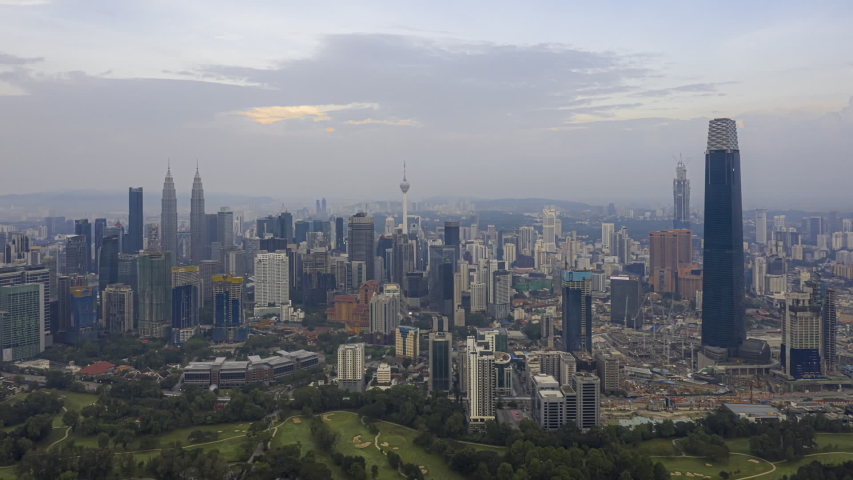 Malaysia Time lapse: Aerial city view during morning overlooking Kuala Lumpur city skyline with national landmarks the Petronas Twin Tower. Federal Territory, Malaysia. Prores 1080p