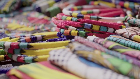 A close up shot of the colourful, handmade beaded jewellery for sale at a crafts market in the Maboneng district of Johannesburg, South Africa. 