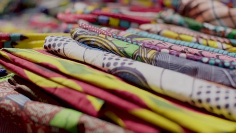 A close up shot of the colourful, traditional African fabric for sale at a crafts market in the Maboneng district of Johannesburg, South Africa. 