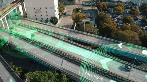 Amazing Aerial View Of The Autonomous Cars Self-Driving Concept , Autopilot cars speeding on multi-level highway at sunset and technology Scans Cars and Pedestrians, Following Movement,  Showing Data.