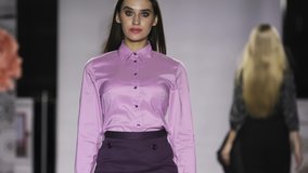 Defile attractive girl in colorful dress on catwalk model show closeup evening vogue 4K. Fashion design modern clothes woman on podium slow motion spotlights stage. - Powered by Shutterstock - Get 15% off with code: PIKWIZARD15