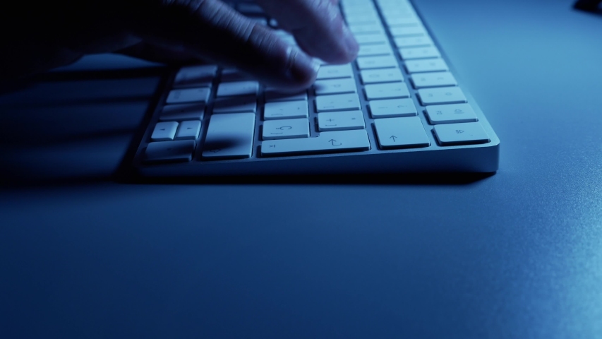 hands of a man typing on a keyboard, bussinesman, human close up on a keyboard, isolated indoors, techonology and work online concept