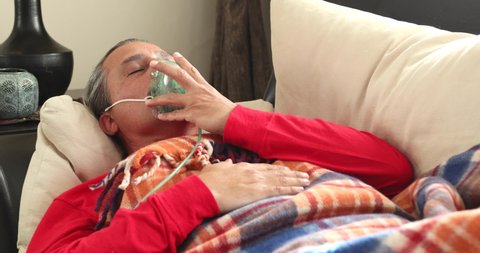 Home Quarantine or İsolation Concept Epidemic Infection Covid-19 Coronavirus Patient With Nebulizer Mask Resting At Home