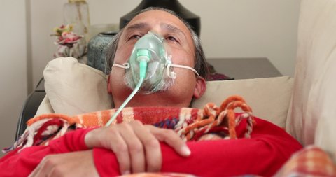 Home Quarantine or İsolation Concept Epidemic Infection Covid-19 Coronavirus Patient With Nebulizer Mask Resting At Home