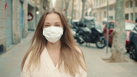 Virus mask spanish woman on street wearing face protection in prevention for coronavirus covid 19. Lady walking in public space on quarantine for food