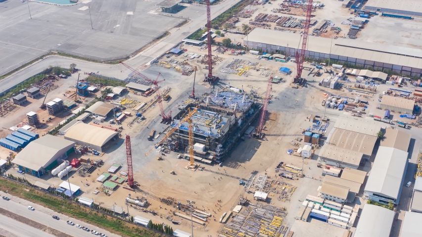 Aerial view Hyperlapse timelapse of Construction building and crane. Large construction site including several excavators and cranes timelapse working on a building complex. time lapse footage B roll. Royalty-Free Stock Footage #1048837054