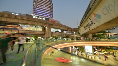 Bangkok, Thialand - MARCH 9,2020: Time lapse traffic sky walk area connects Siam Discovery department store and MBK Center over the Pathumwan Intersection in bangkok