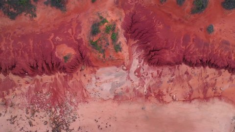 Aerial top down view of incredible Mars-like red landscape along coastline of the Kimberley, Western Australia