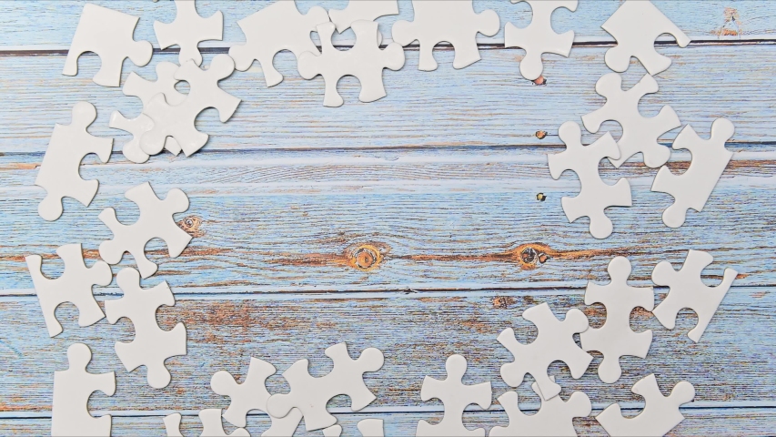 Stop motion of puzzle for teamwork. Playing jigsaw game. Business successful and goal concept Royalty-Free Stock Footage #1048850413