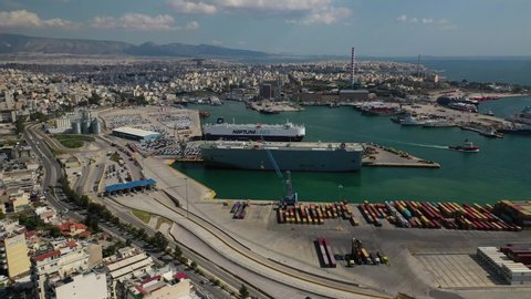 Keratsini, Attica / Greece - March 15 2020: Aerial drone video of ro ro car carrier vessel terminal