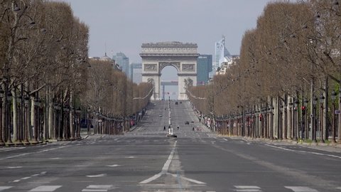 PARIS, FRANCE March 22th 2020 : The Arc de Triomphe, Triumphal arch and Champs Elysées, sighted from Place de la Concorde empty because of containment measures due to the Covid-19 Coronavirus. 