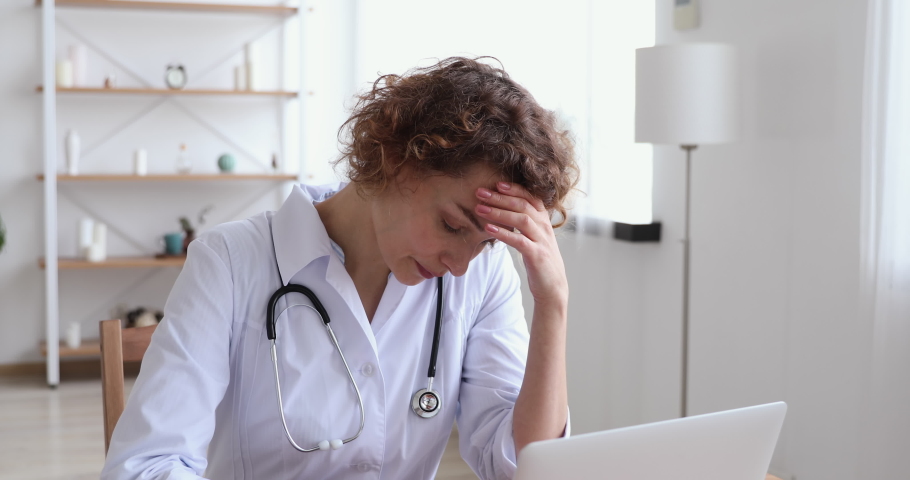 Upset young female doctor feeling tension, guilt blaming herself for professional mistake. Depressed worried woman therapist thinking of mental fatigue, anxious about tragic case at work concept. Royalty-Free Stock Footage #1048870807