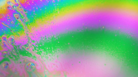 Bubbles swirling in Rainbow liquid colors. Dreamy hypnotic abstract background
