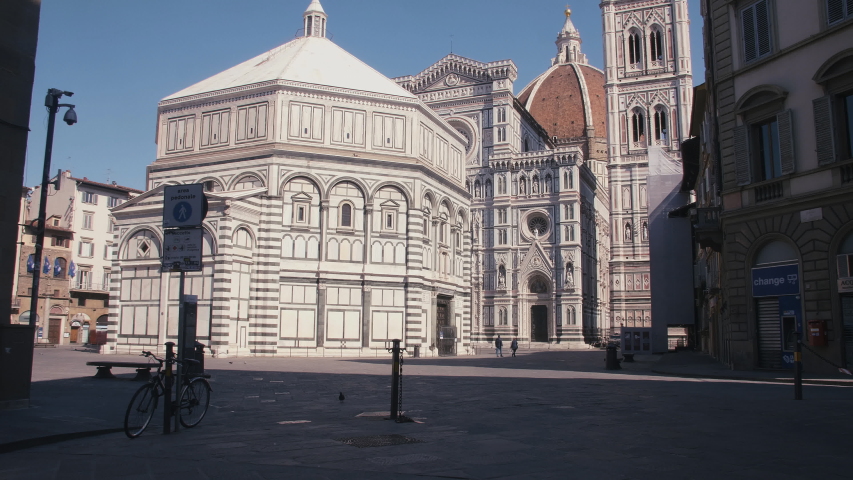 Florence, Italy - March 19th 2020: Coronavirus COVID 19 quarantine, empty city of Florence (Italy, Europe). Empty Piazza San Giovanni, Florence Duomo.