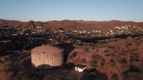 4K aerial drone video savanna hills, old historical water storage reservoirs in Klein Windhoek residential suburb in Namibia's capital in central highland Khomas Hochland of Namibia, southern Africa