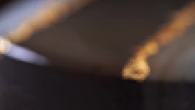 Close up chocolate frosting with gold foil garnish on delicious premium cake. macro, panning shot. Rack focus pulling  - Powered by Shutterstock - Get 15% off with code: PIKWIZARD15