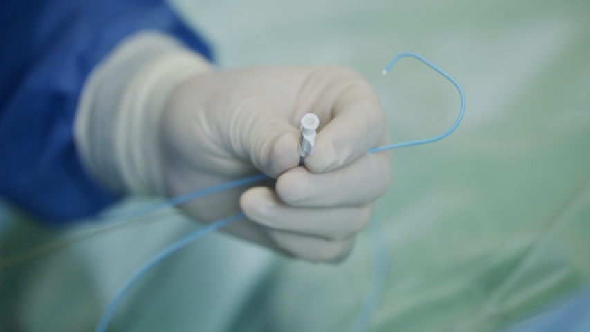 Close up on Surgeon hand during a heart catheterization Royalty-Free Stock Footage #1048899301