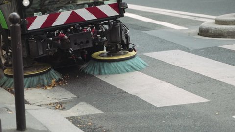 Paris, France - 03 20 2020: street sweeper cleaning dirty road in Paris during coronavirus lockdown