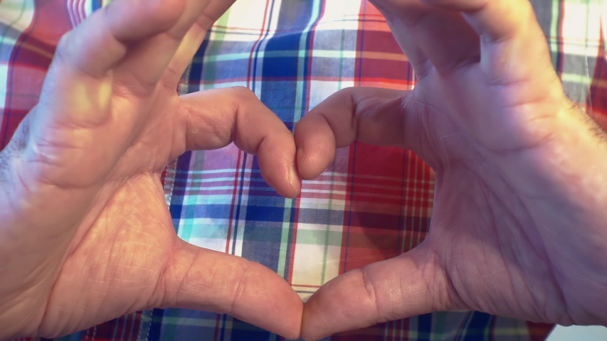 Europian young man making gest hands in heart shape, heart health insurance, social responsibility, donation charity concept, world heart day, International Day of Sign Languages. | Shutterstock HD Video #1048907731