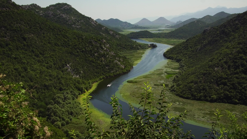 Panorama of a winding river, Lake Skadar National Park, Montenegro. seen from Pavlova Strana panoramic lookout. Summer tourism & family travel destination in Balkans Europe.
