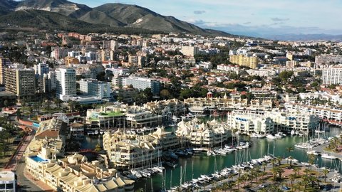 4K Drone footage of the port Puerto Marina in Benalmadena with boats, city and mountains