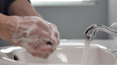 Female Hands Washing In Basin Corona virus disease