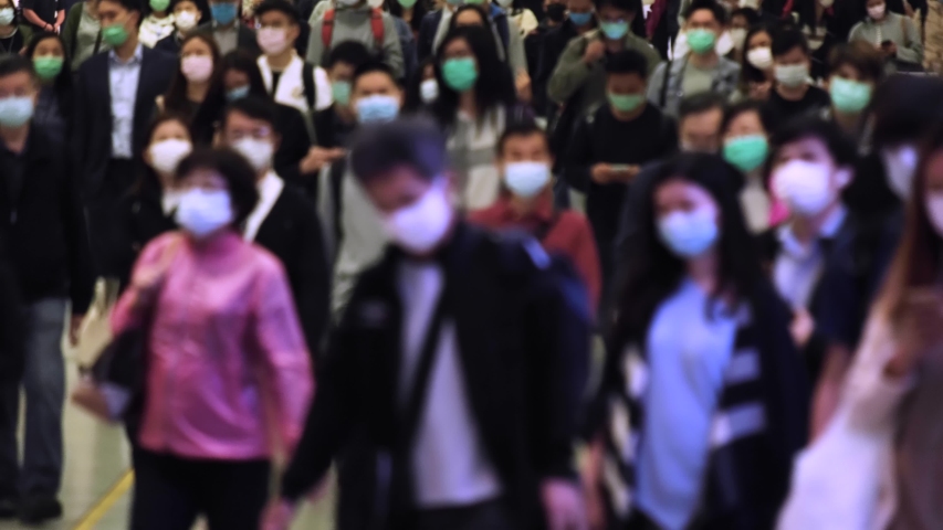 Slow motion of unrecognized people wearing medical face masks at metro in Hong Kong. Coronavirus concept Royalty-Free Stock Footage #1048926397