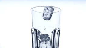 Ice Cubes falling into glass in super slow motion.  - Powered by Shutterstock - Get 15% off with code: PIKWIZARD15
