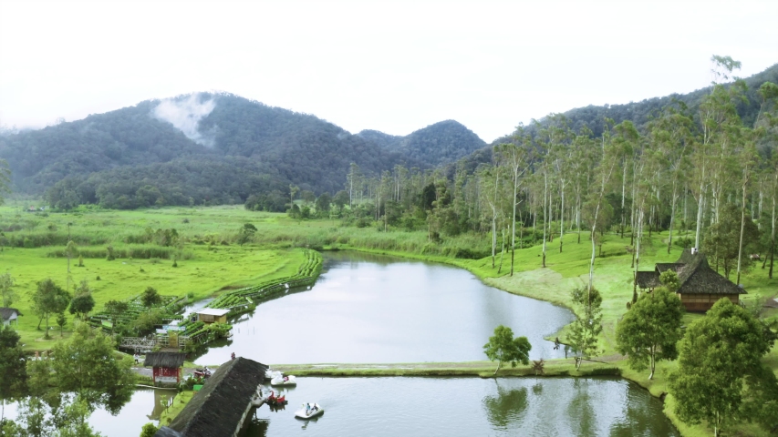 Vacation In A Small Lake Near The Mountain Area