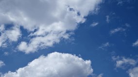 Beautiful close-up white clouds on the blue sky. Timelapse sky clouds.
